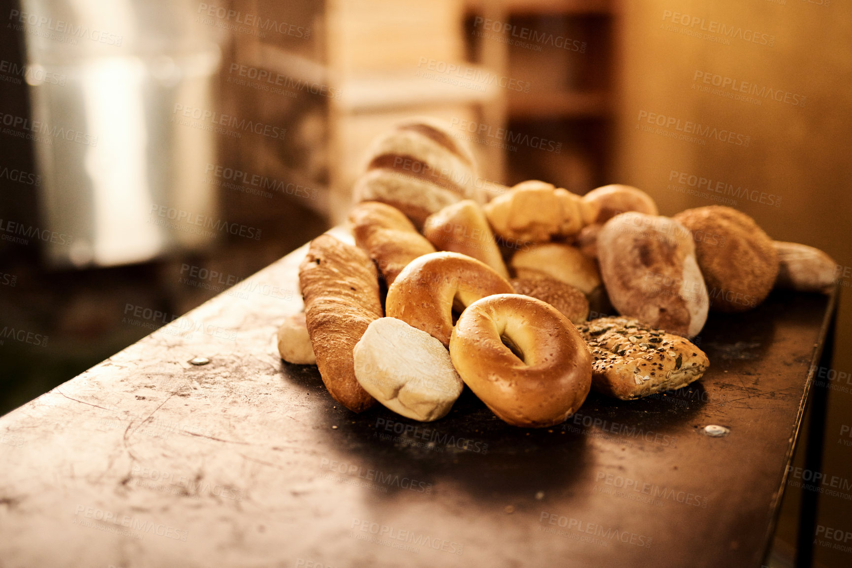 Buy stock photo Closeup shot of a selection of freshly baked bread on a wooden table