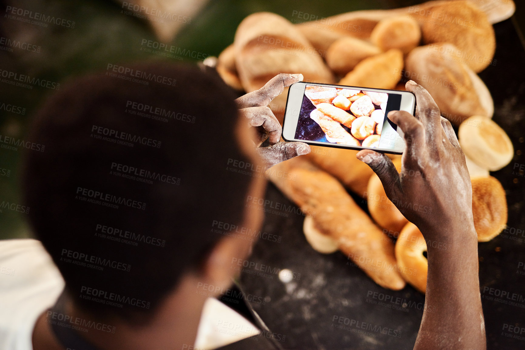 Buy stock photo Black man, bakery or above with phone screen for photography, picture or bread at store. Top view, male person or baker with mobile smartphone for content creation, rolls or collection at pastry shop