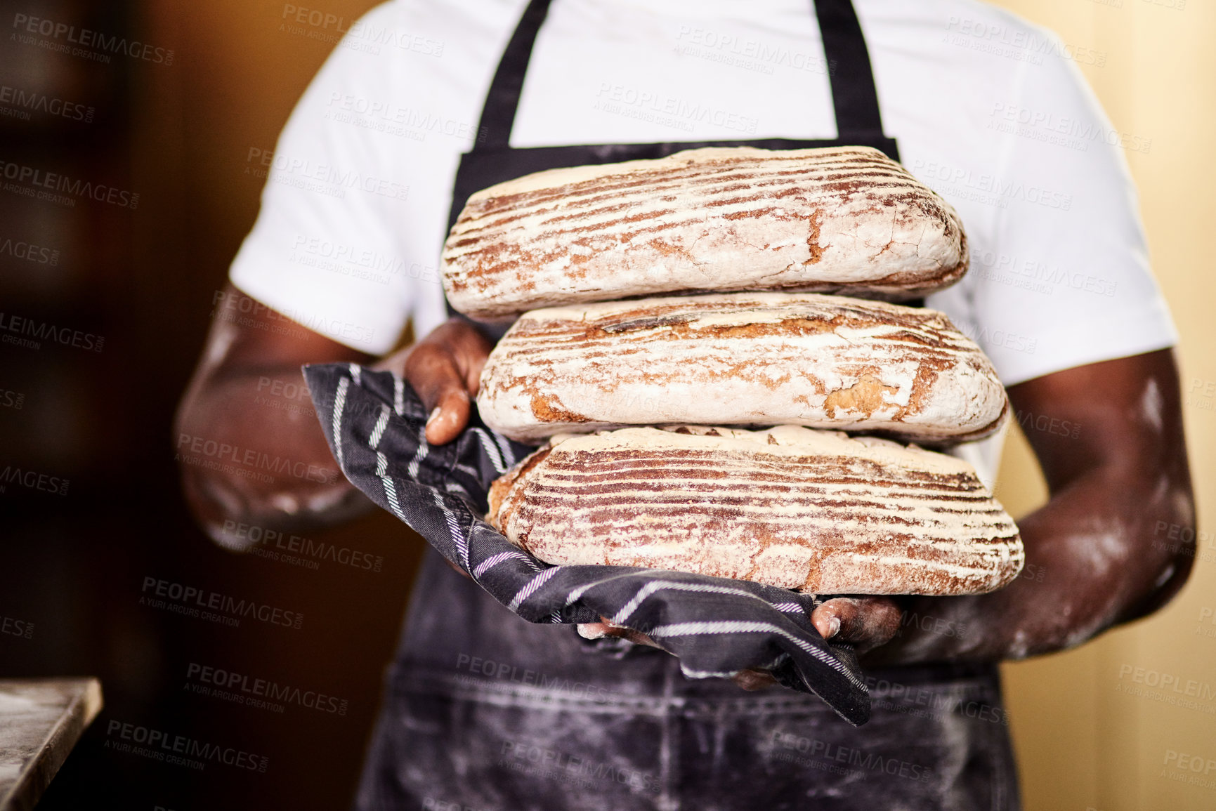 Buy stock photo Black man, hands and bakery with bread for pastry, production or handmade cuisine at shop. Closeup, male person or baker with loafs or rolls for food, wheat delicacy or flour produce at factory