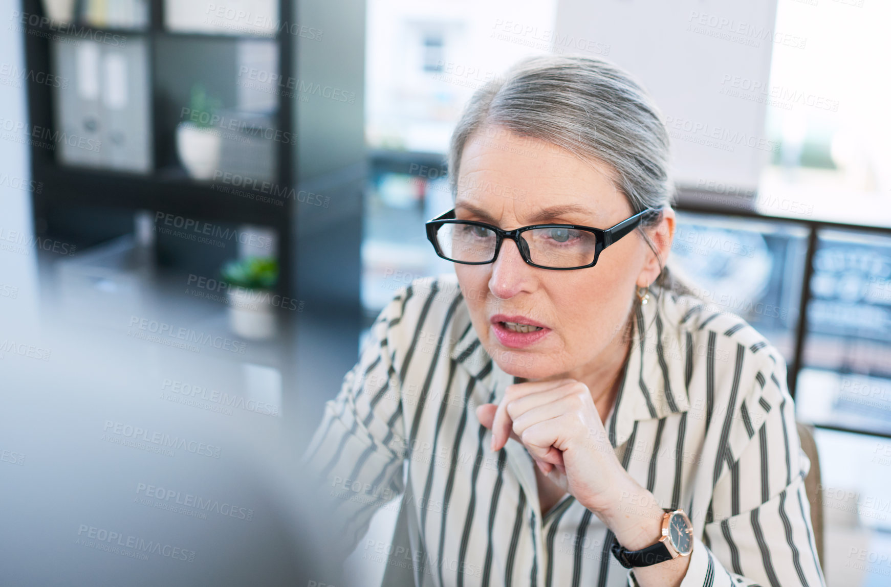 Buy stock photo Reflection, reading and mature business woman on computer for problem solving, solution or email. Planning, glasses and manager thinking, concentration or review for publication at creative startup