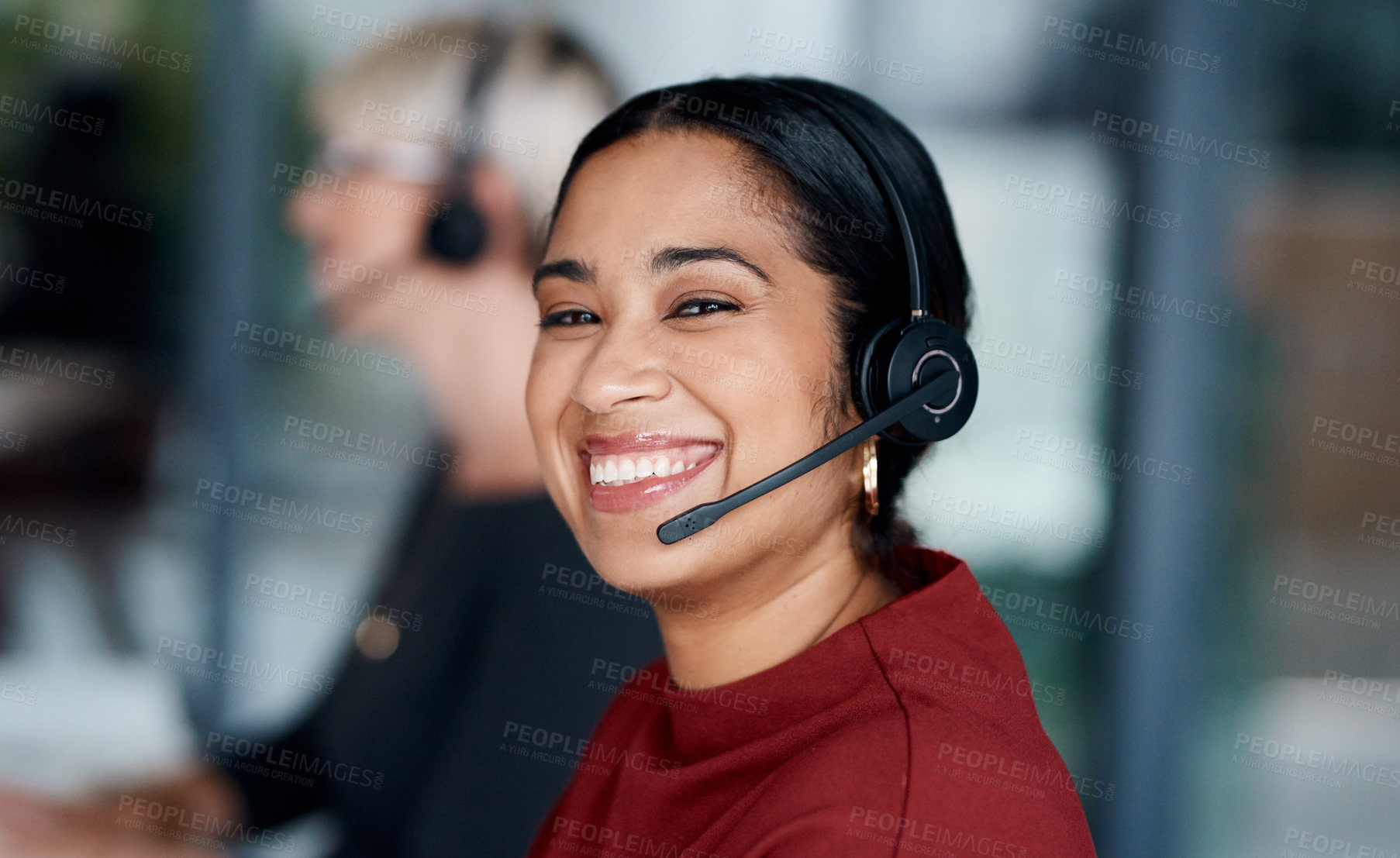 Buy stock photo Portrait of a young businesswoman wearing a headset while working in an office