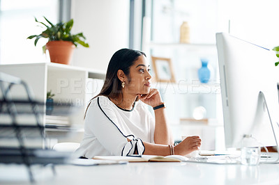 Buy stock photo Shot of a young businesswoman working on a computer in an office