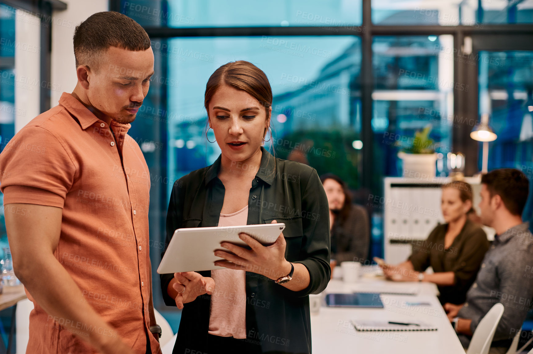 Buy stock photo Business people, tablet and working in office for teamwork, discussion and project deadline with app. Partnership, evening and collaboration in workplace for planning, research or development ideas