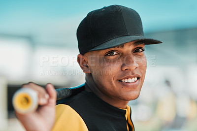 Buy stock photo Shot of a young baseball player holding a baseball bat while posing outside on the pitch