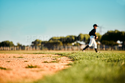 Buy stock photo Defocused shot of a baseball player running during a game