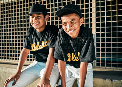 Buy stock photo Portrait of two young baseball players sitting together