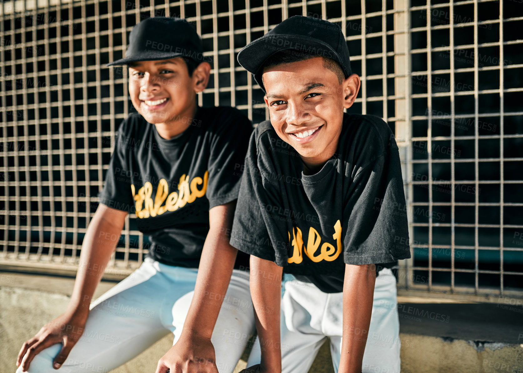 Buy stock photo Portrait of two young baseball players sitting together