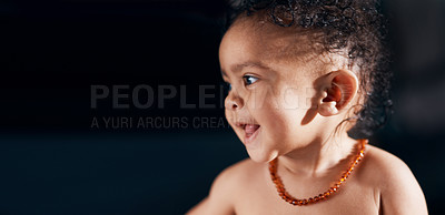 Buy stock photo Studio shot of an adorable baby boy against a black background