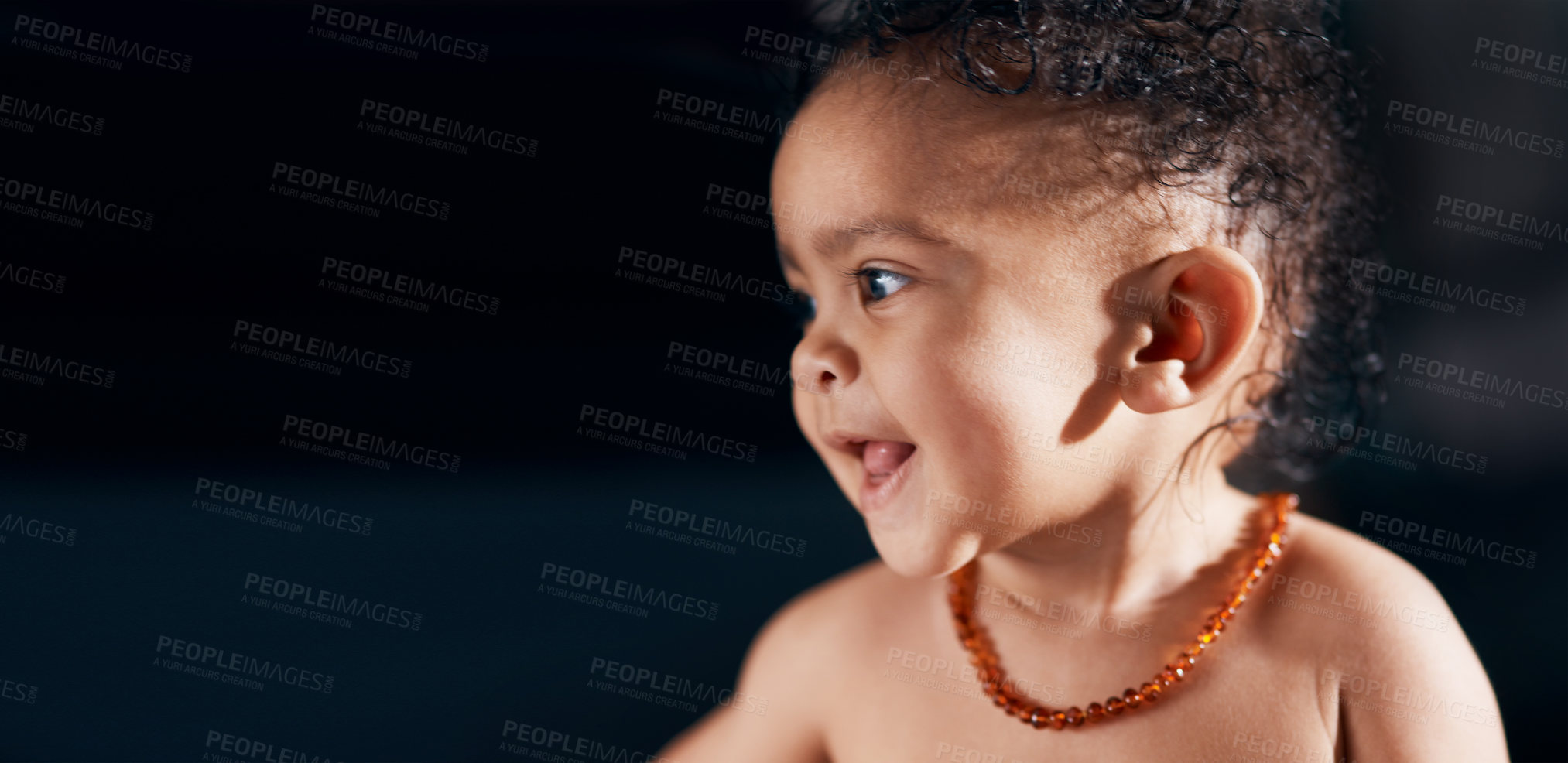 Buy stock photo Studio shot of an adorable baby boy against a black background