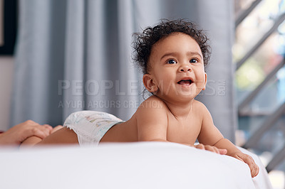 Buy stock photo Home, relax and baby with smile in bedroom for development, resting and wellness on weekend. Sweet, innocent and curious adorable kid with diaper for comfortable, growth and happiness in childhood