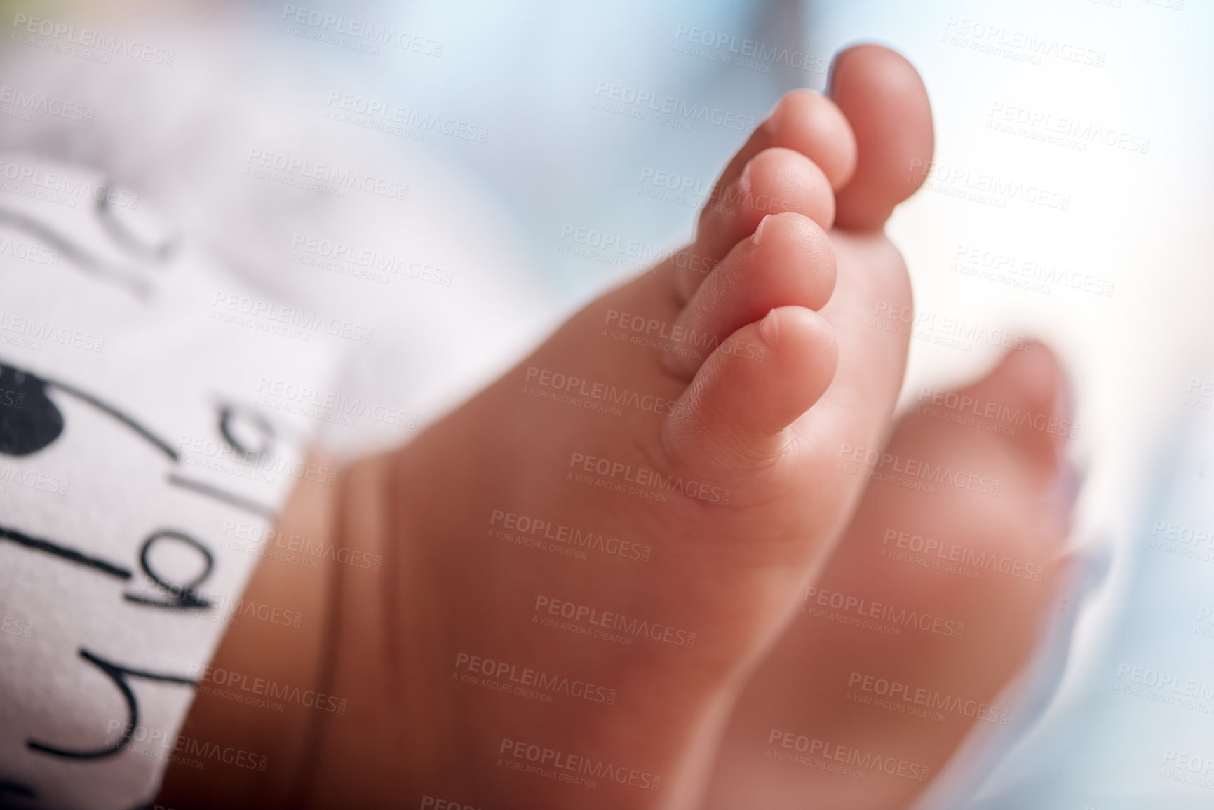 Buy stock photo Cropped shot of an unrecognisable baby’s adorable feet at home