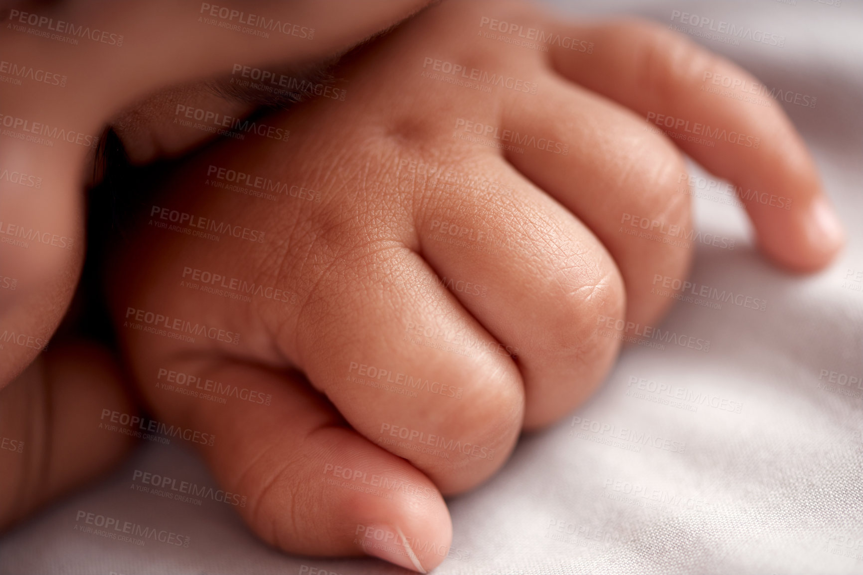 Buy stock photo Shot of an adorable baby boy sleeping peacefully on the bed at home