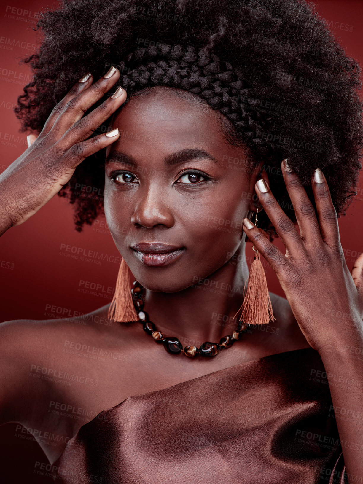 Buy stock photo Portrait, beauty and black woman with fashion in studio isolated on a red background. Natural face, makeup cosmetics and confident African model with stylish outfit, traditional headband or aesthetic