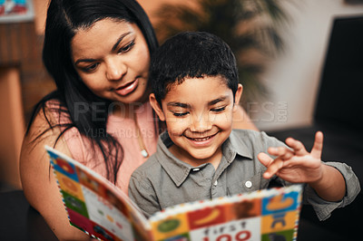 Buy stock photo Mother, son and happy with book, learning and reading together with support, care and love in family home. Woman, boy child and teaching for education, development and life skills in house with story