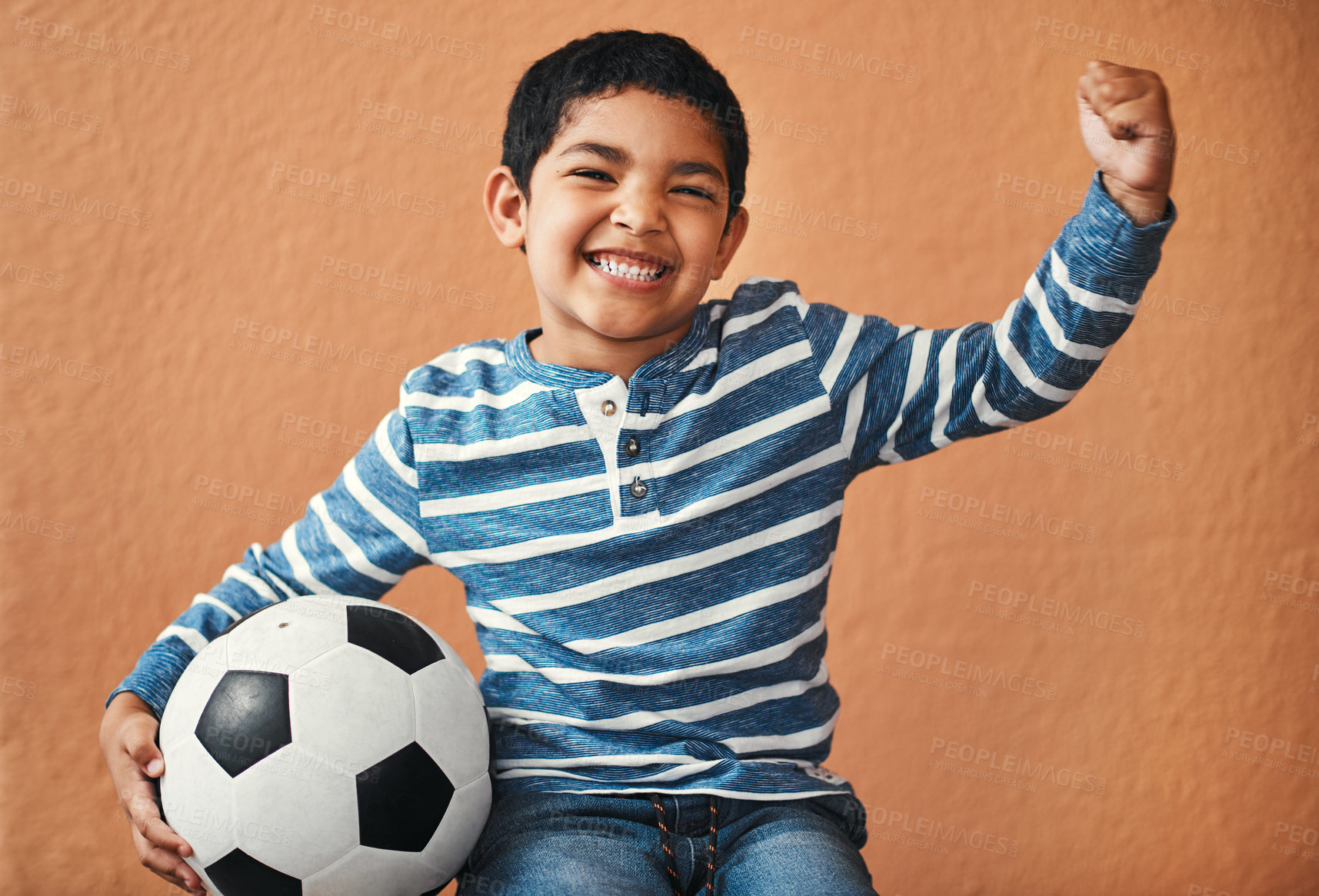 Buy stock photo Portrait of an adorable little boy posing with a soccer ball