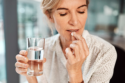 Buy stock photo Pill, water and senior woman drinking medicine or supplements for illness or health care in her office. Medical, drugs and sick elderly female person healing and drink tablet or vitamin