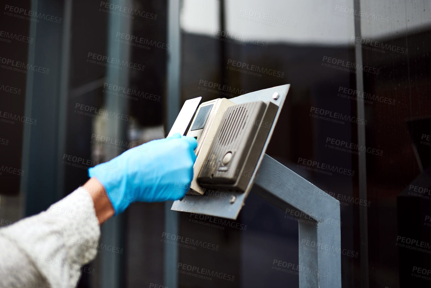 Buy stock photo Closeup shot of an unrecognisable woman using an access card to gain entry into a building