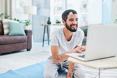 Buy stock photo Exercise, laptop and man on floor in home living room for online class or routine and watching yoga tutorial. Computer, demonstration and pilates with yogi on mat for virtual fitness lesson in lounge