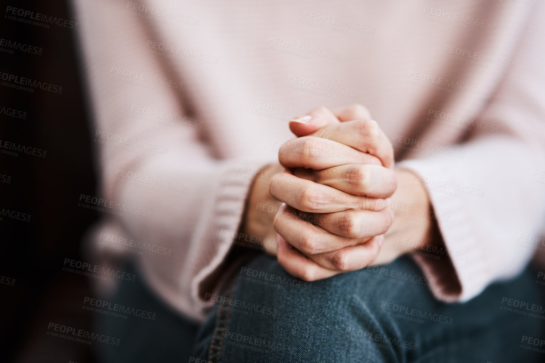 Buy stock photo Woman, hands together and closeup with stress and anxiety in therapy for psychology crisis. Pray, mental health and problem with hand of a female patient scared with depression at counselling on sofa