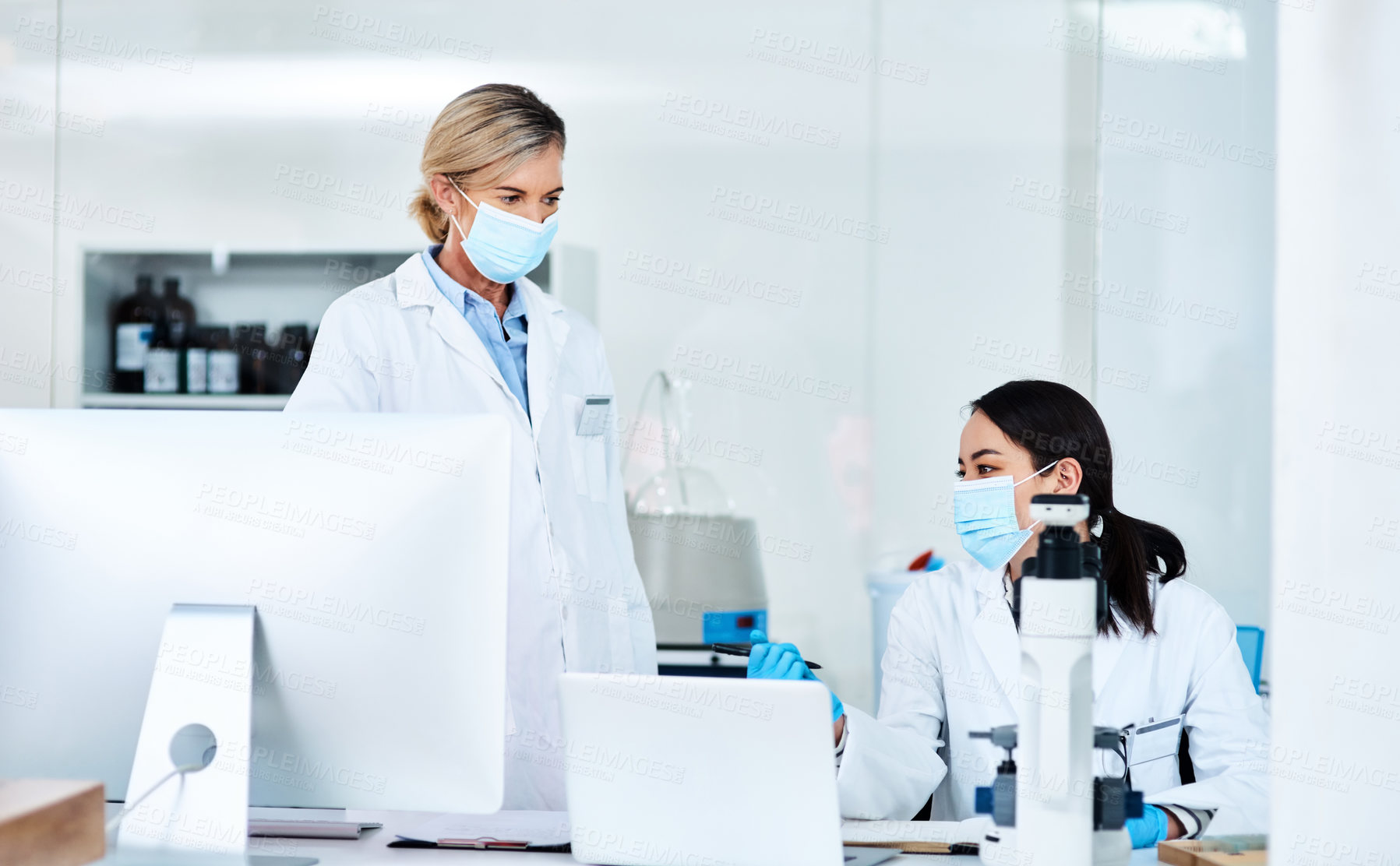 Buy stock photo Shot of two scientists working together in a lab