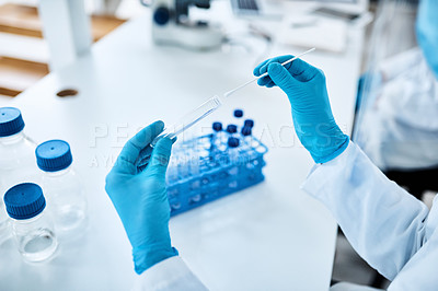 Buy stock photo Closeup shot of an unrecognisable scientist holding a sampling swab and test tube in a lab