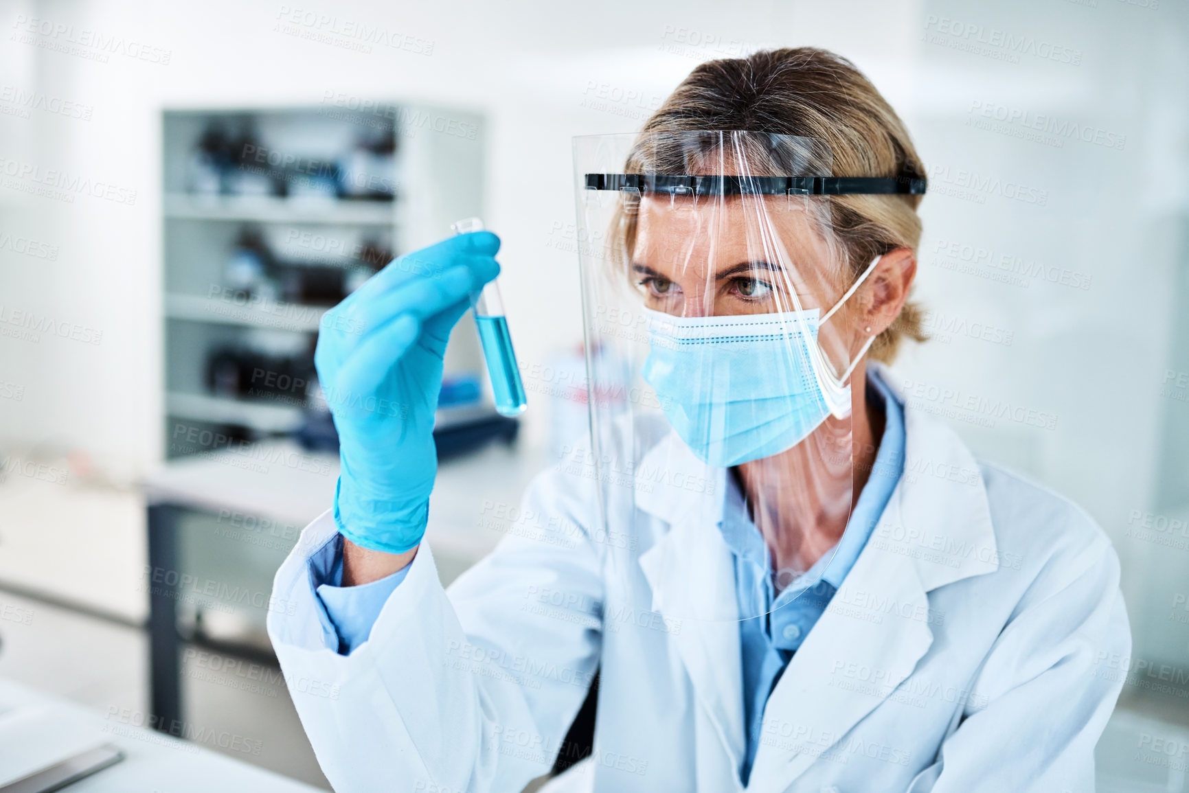 Buy stock photo Shot of a mature scientist analysing samples in a lab