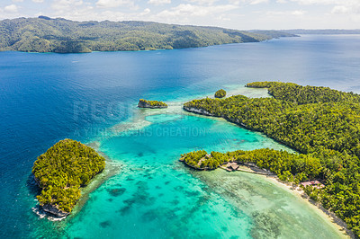 Buy stock photo High angle shot of the Raja Ampat Islands surrounded by the Indo-Pacific Ocean