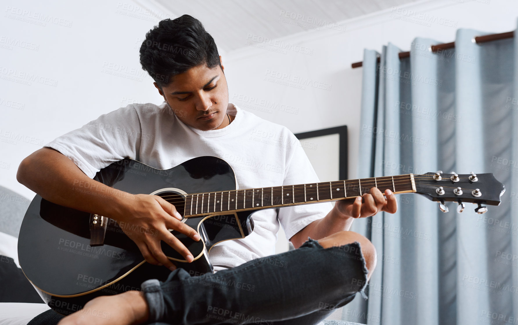 Buy stock photo Musician, guitar or man learning in home for performance practice, hobby or solo track with talent. Equipment, creative person and Indian songwriter playing instrument with sound or musical skills