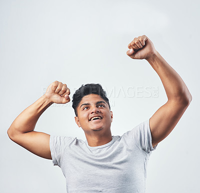 Buy stock photo Studio shot of a young man posing against a white background