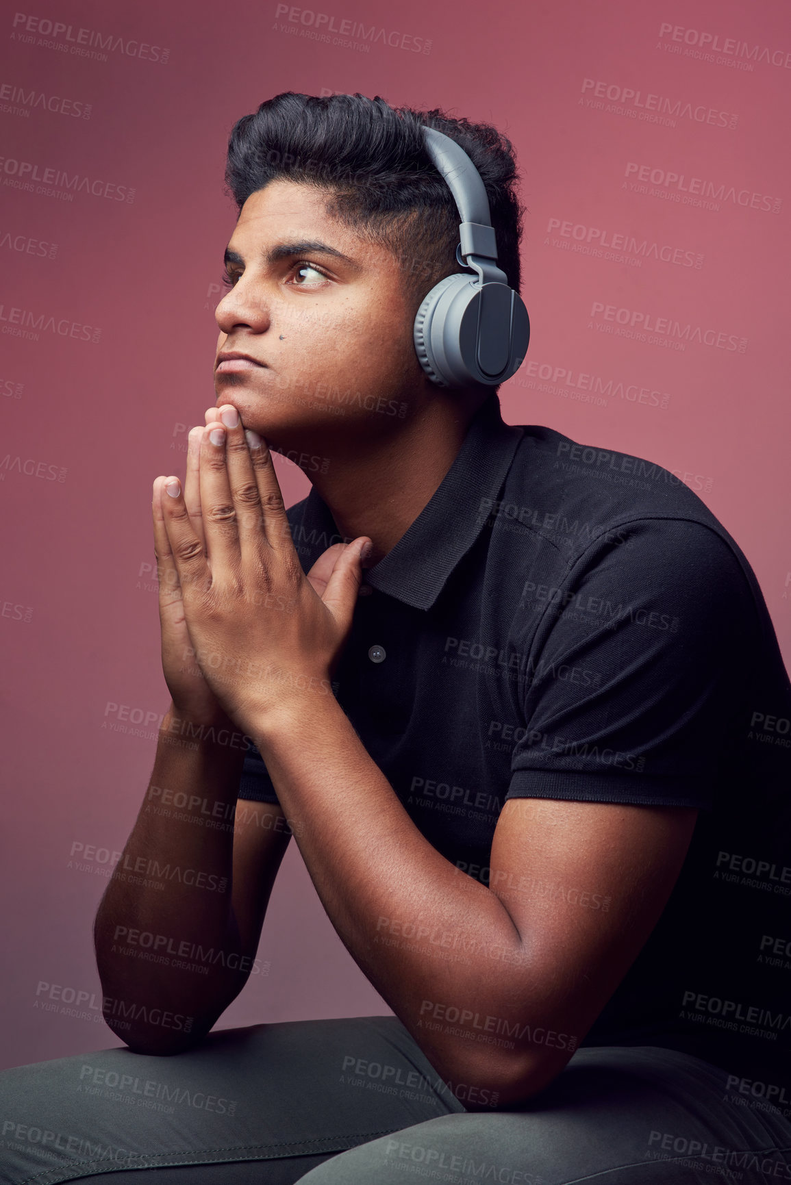 Buy stock photo Studio shot of a handsome young man wearing headphones