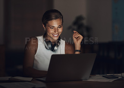 Buy stock photo Shot of a young businesswoman using a laptop during a late night at work