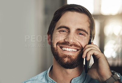 Buy stock photo Portrait of a young businessman using a smartphone in a modern office