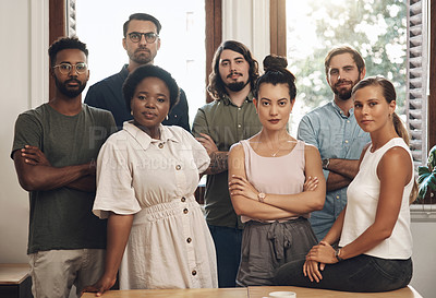 Buy stock photo Serious business people standing with arms crossed, looking confident and showing teamwork in an office together at work. Portrait of diverse creative employees expressing power, unity and success