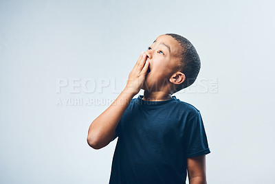 Buy stock photo Studio shot of a cute little boy looking amazed against a grey background