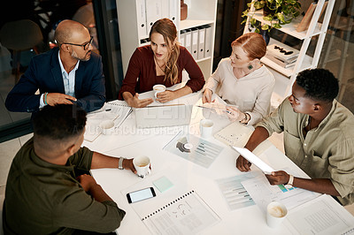 Buy stock photo Meeting, planning and strategy with a business team or group of colleagues in the boardroom during a mission and vision discussion. Diverse corporate professionals reading paper work from above