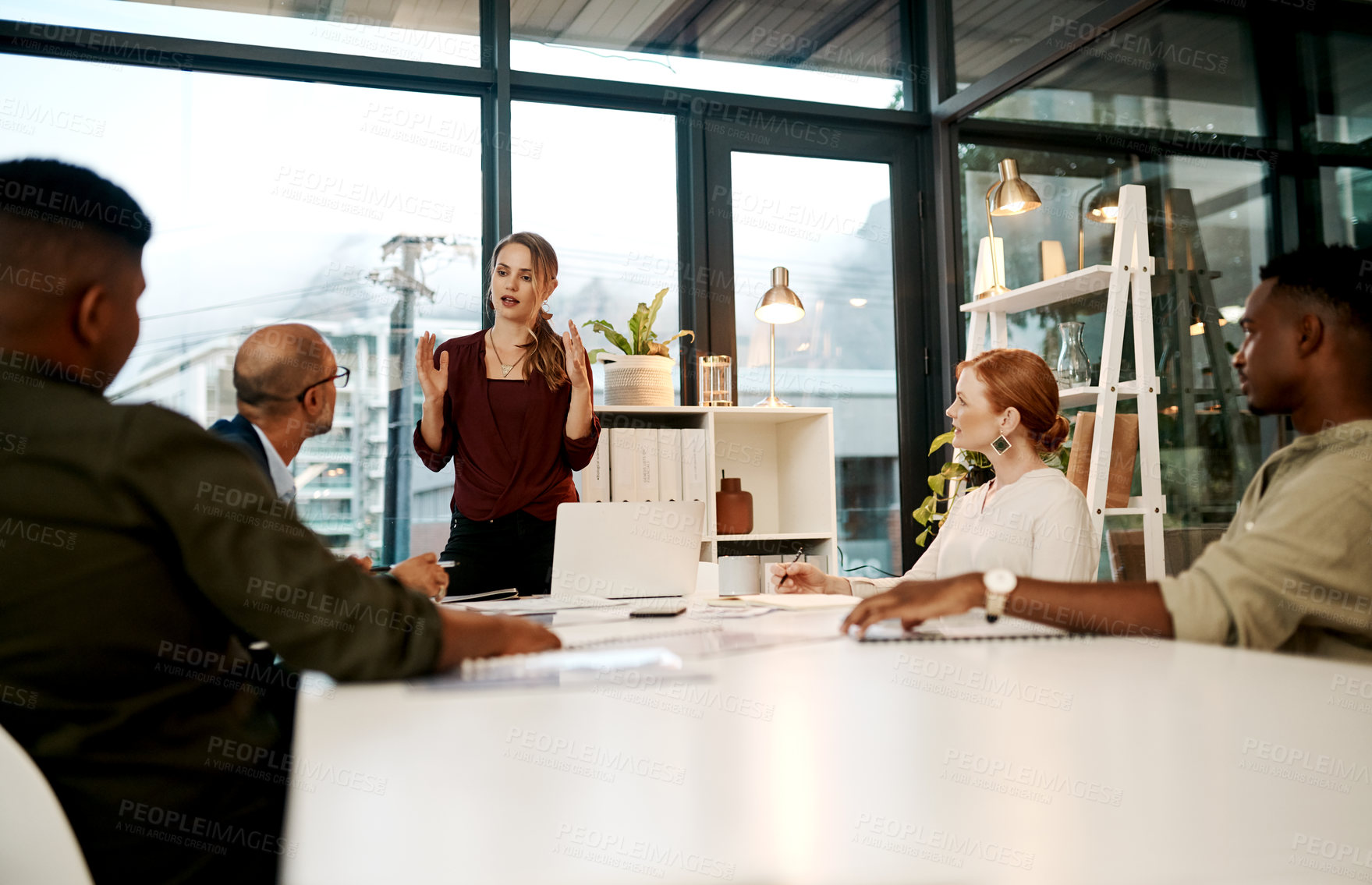 Buy stock photo Business woman, meeting and coach with group for brainstorming, discussion or presentation at office. Female person, employee or speaker talking to team in boardroom for company plan or improvement