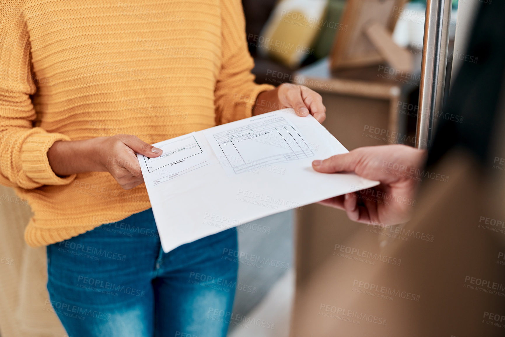 Buy stock photo Cropped shot of a woman receiving an invoice for a delivery at home