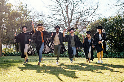 Buy stock photo Excited students, celebration and graduation with certificate on grass field for achievement or qualification at campus. Happy group, people or graduates running with smile for diploma or degree