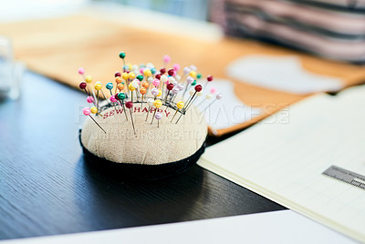 Buy stock photo Still life shot of colourful pins on a pincushion