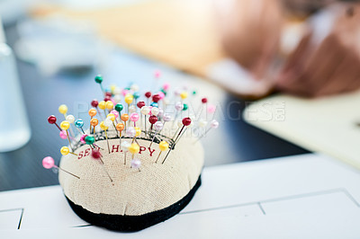 Buy stock photo Still life shot of colourful pins on a pincushion