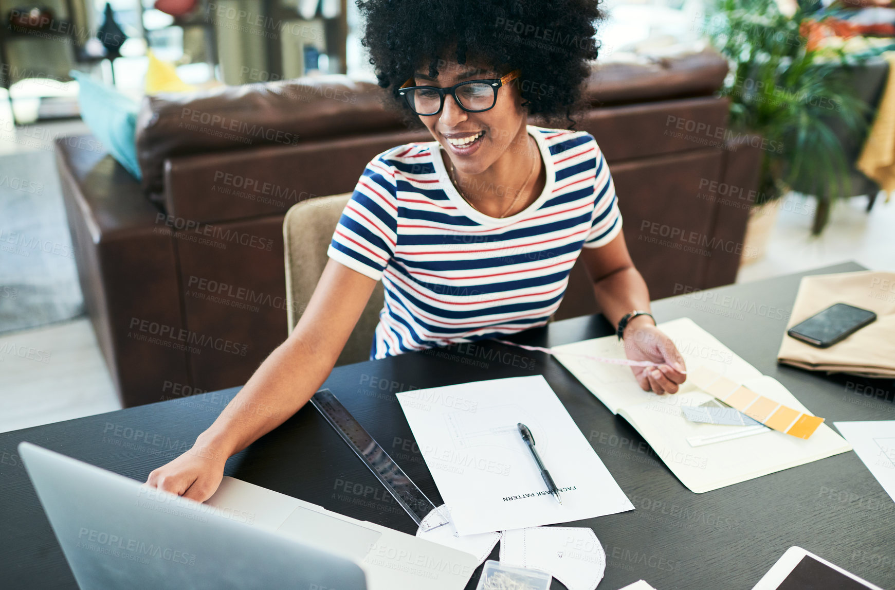 Buy stock photo Happy, black woman and designer with laptop, documents or color palette for interior design or project at home. Young, female person or freelancer with smile on computer in remote work for DIY ideas