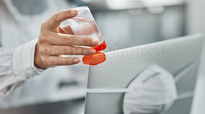 Buy stock photo Cropped shot of a businesswoman using hand sanitiser while working at her desk in a modern office