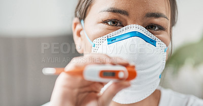 Buy stock photo Cropped shot of a woman wearing a mask while holding up a thermometer