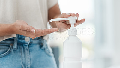 Buy stock photo Cropped shot of an unrecognizable woman sanitising her hands
