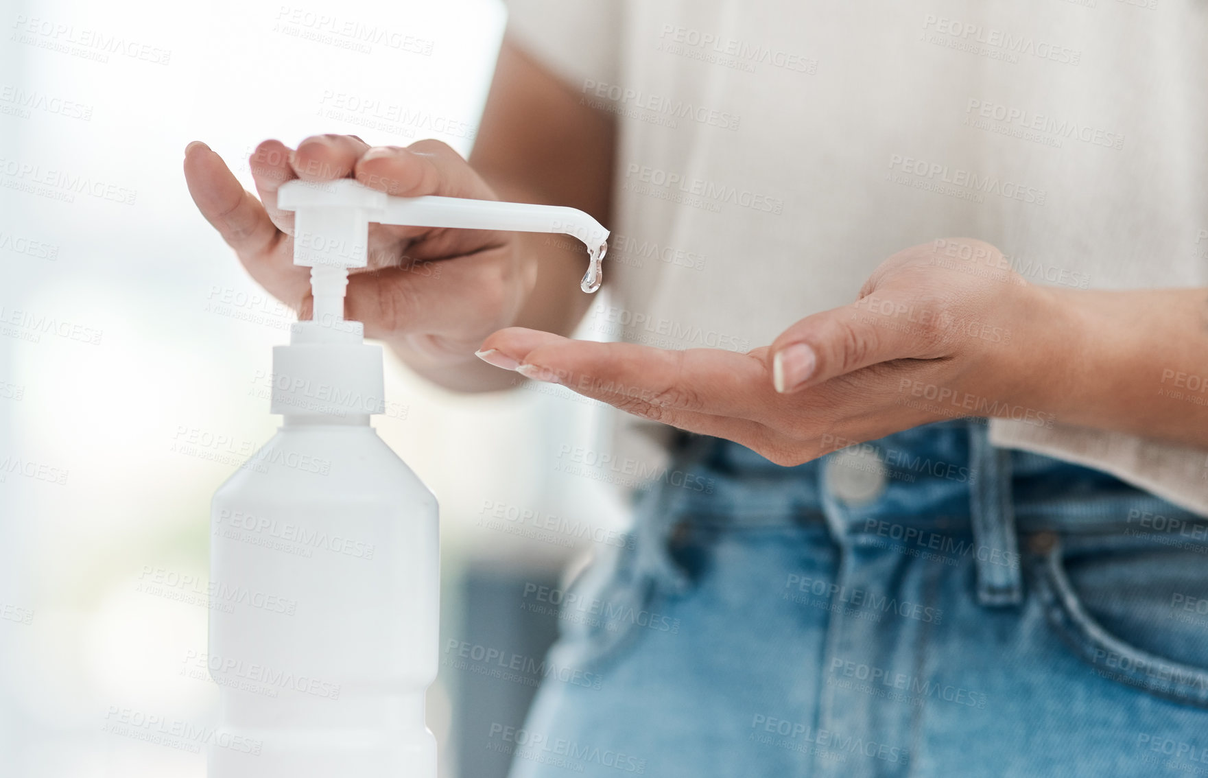 Buy stock photo Cropped shot of an unrecognizable woman sanitising her hands