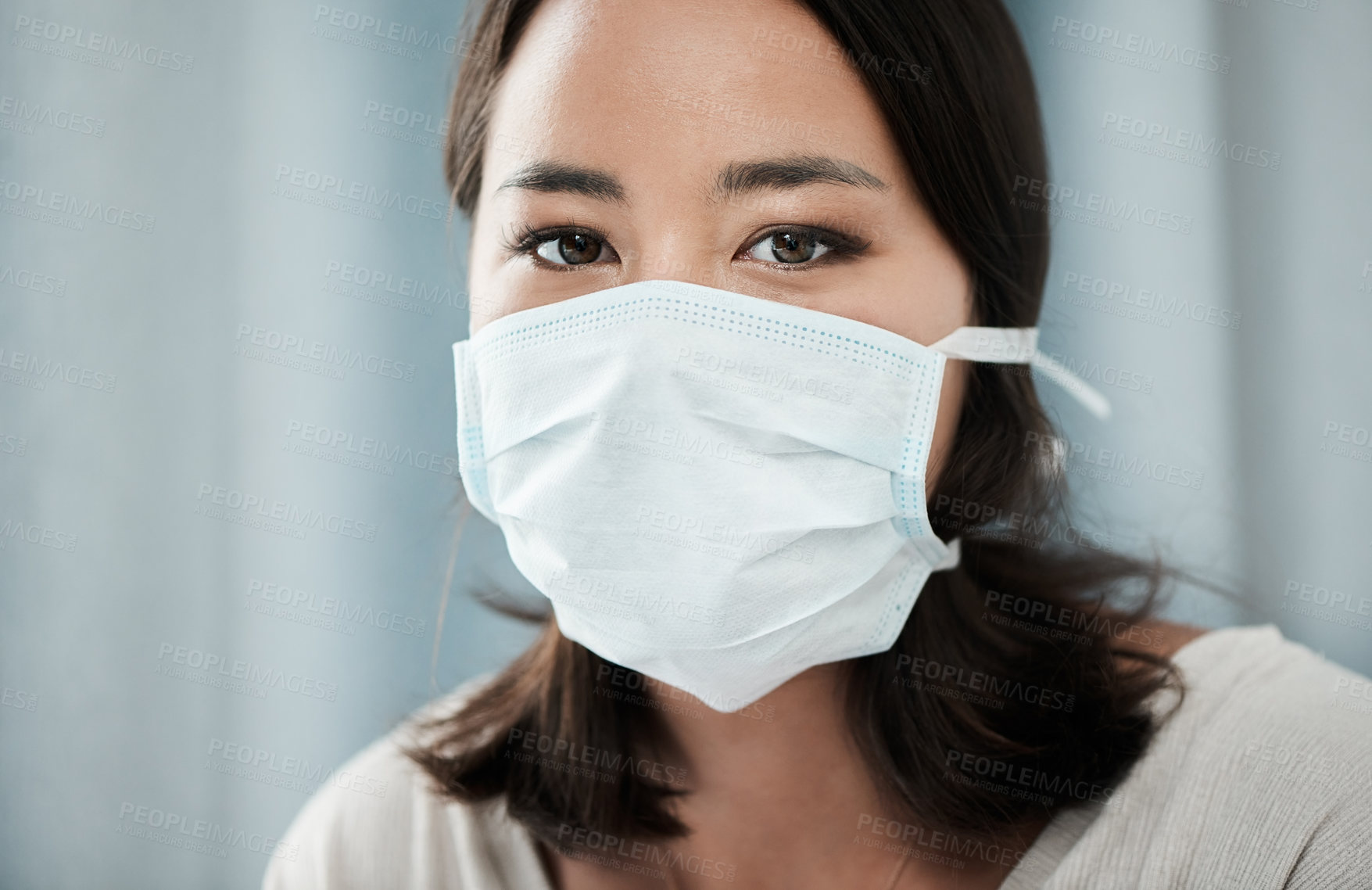 Buy stock photo Closeup shot of a beautiful young woman wearing a mask