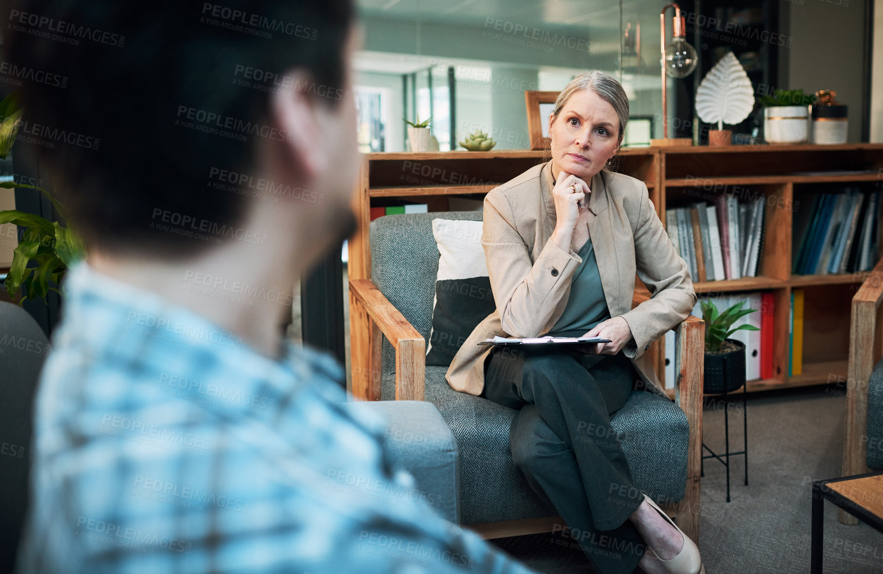 Buy stock photo Shot of a mature woman having a therapeutic session with her patient