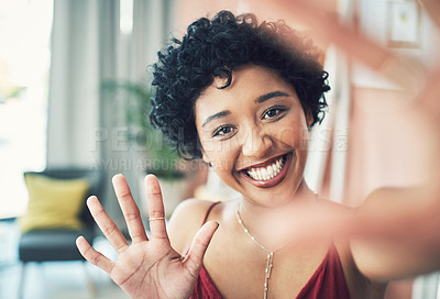 Buy stock photo Cropped shot of a beautiful young woman recording herself at home