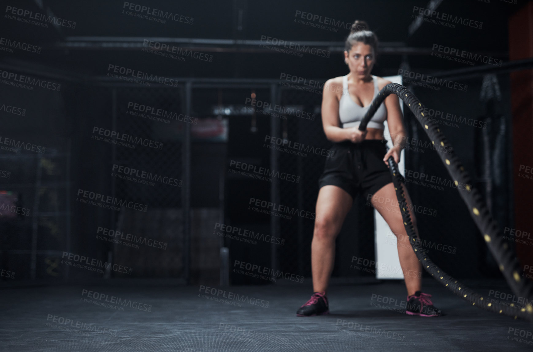 Buy stock photo Sports, battle ropes and woman at the gym doing strength, cardio and challenge exercise with space. Fitness, energy and strong female athlete doing health workout or training with equipment for power
