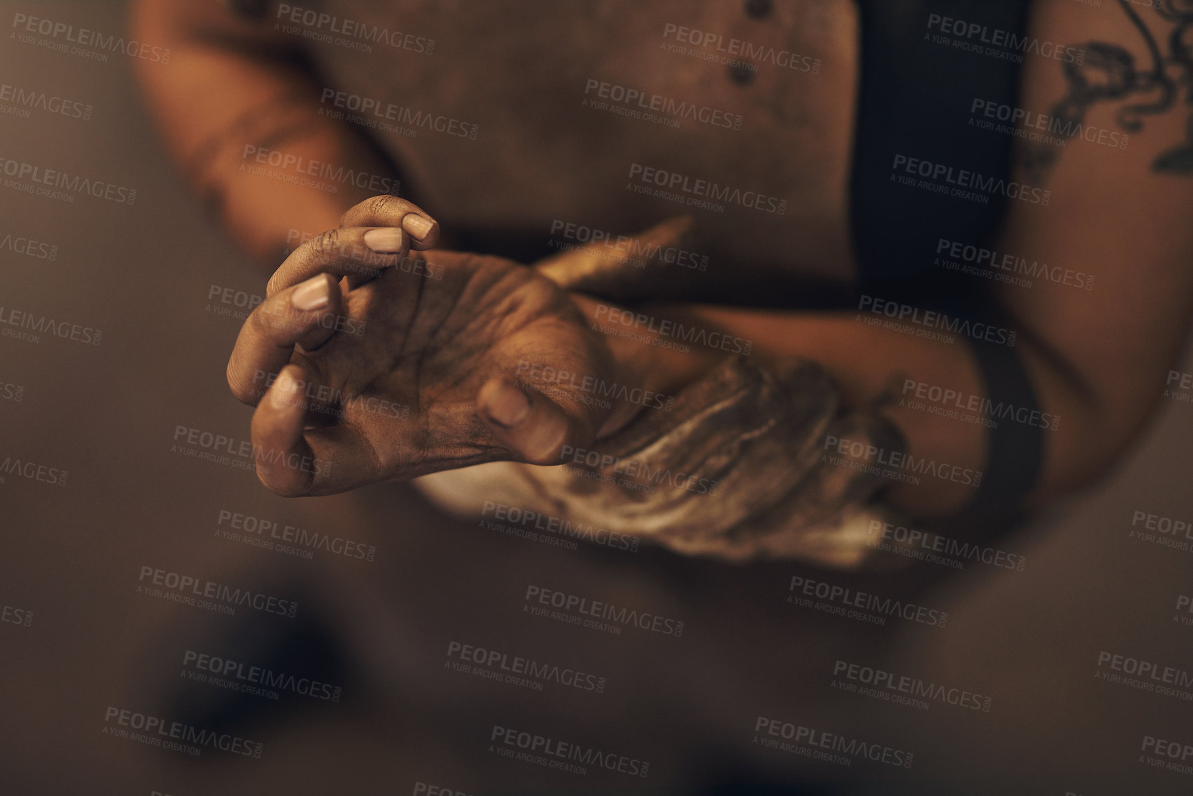 Buy stock photo Shot of a woman experiencing wrist pain while working at a foundry